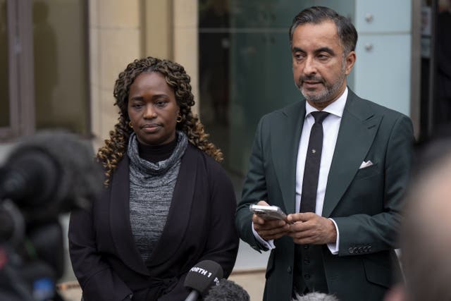 Skehu Bayoh’s sister Kadi Johnson with family solicitor Aamer Anwar (PA)