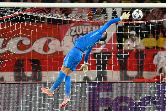 Tottenham goalkeeper Guglielmo Vicario makes a save against Monaco (Philippe Magoni/AP)