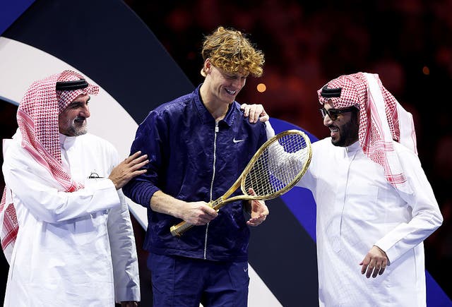 <p>Jannik Sinner of Italy with Yasir Al-Rumayyan and Turki Al-Sheikh after winning the Six Kings Slam in Saudi Arabia</p>