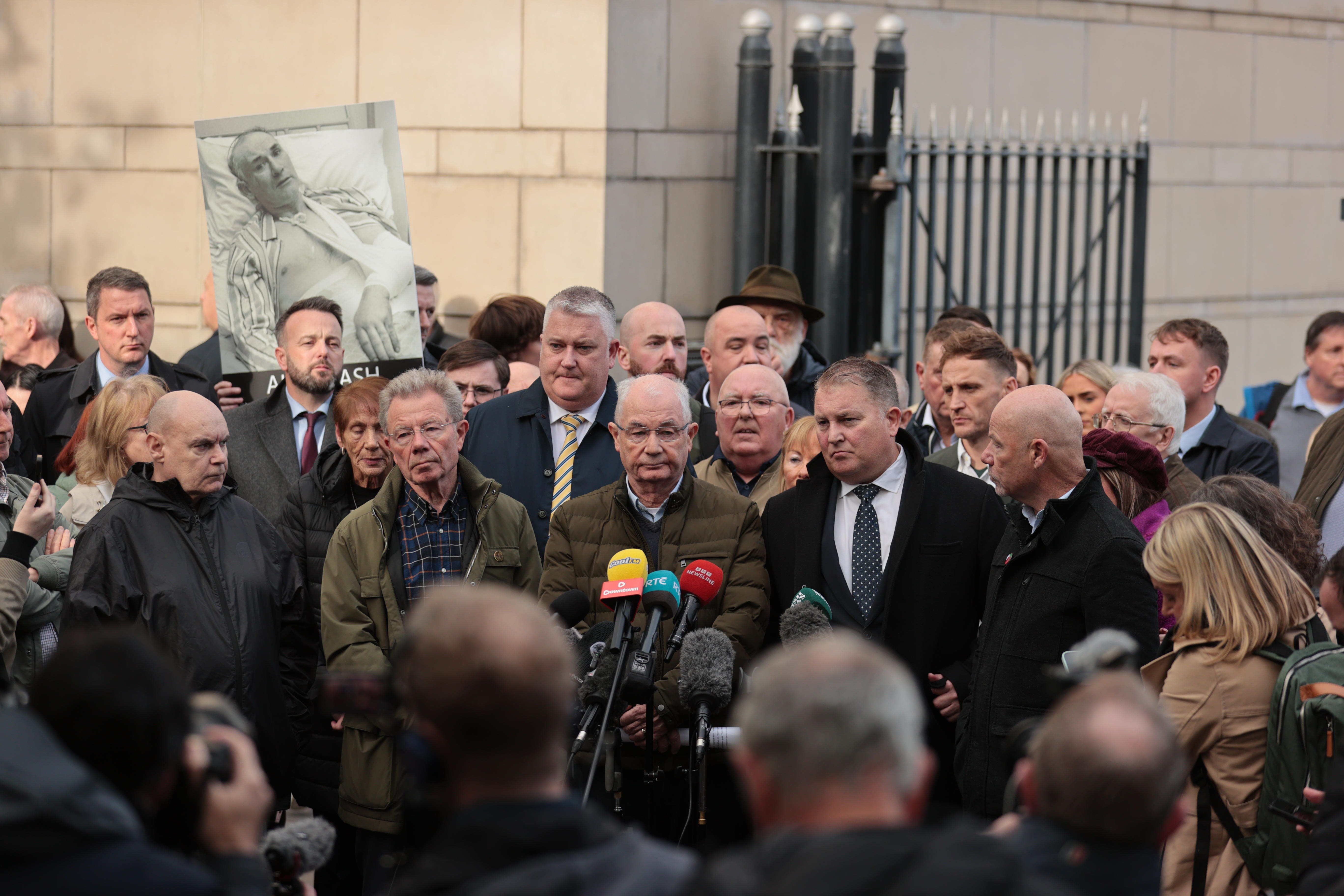 The brothers of Bloody Sunday victim William McKinney, Joe (second left), Mickey (third left), and John (right), speak to the media outside Belfast Crown Court alongside solicitor Ciaran Shiels (second right) (Liam McBurney/PA)