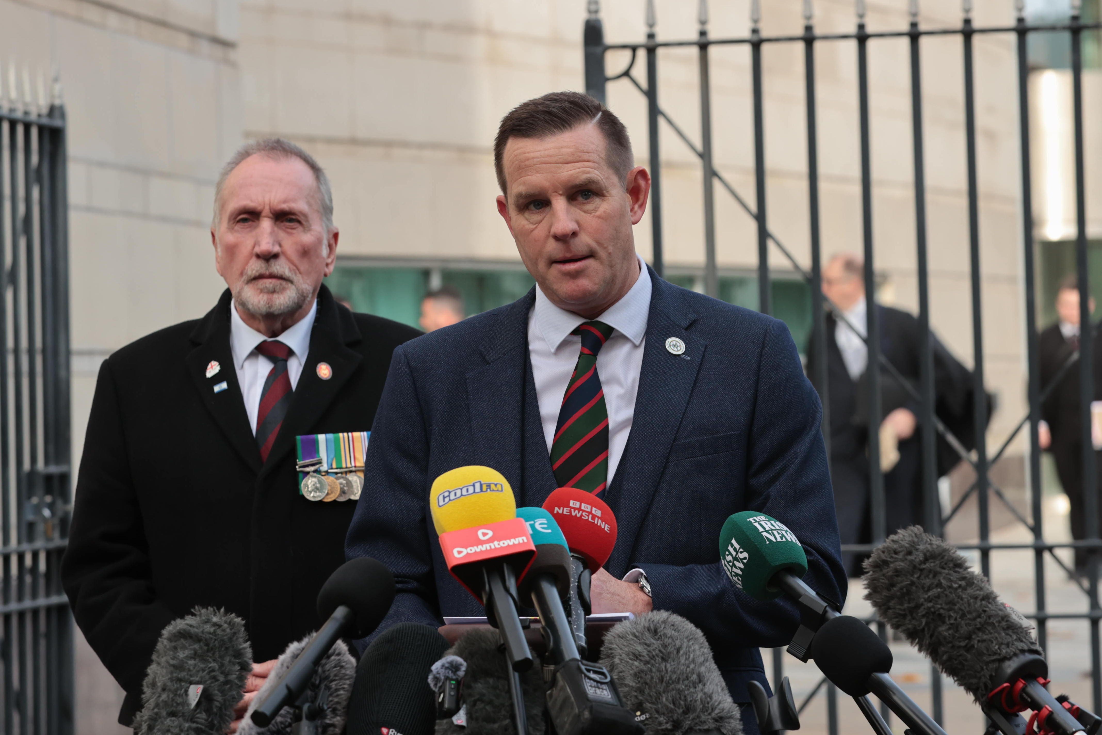 Paul Young, left, and David Johnstone speak to the media outside Belfast Crown Court (Liam McBurney/PA)