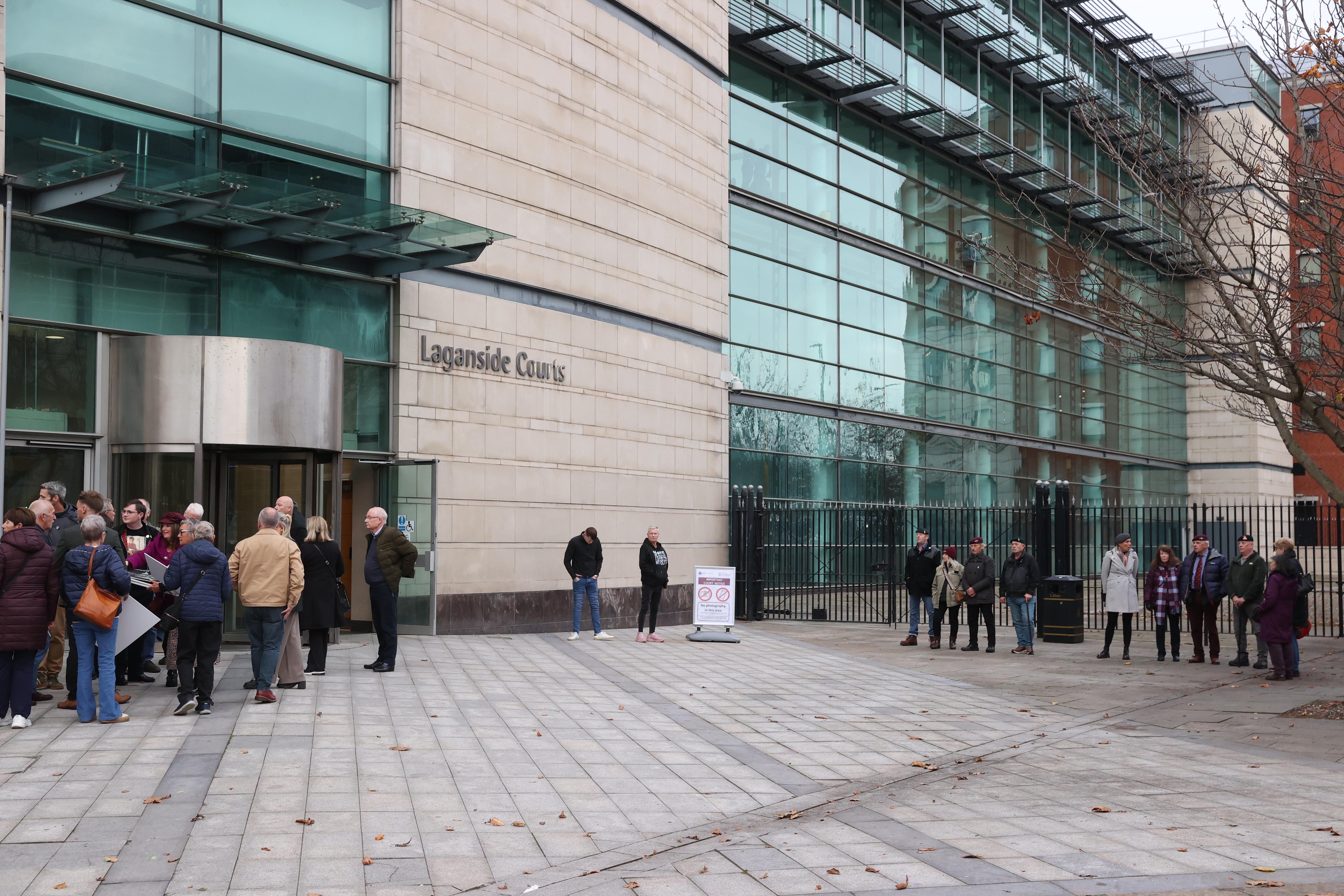 Supporters of Soldier F, right, and family members of Bloody Sunday victims, left, arrive at Belfast Crown Court (Liam McBurney/PA)