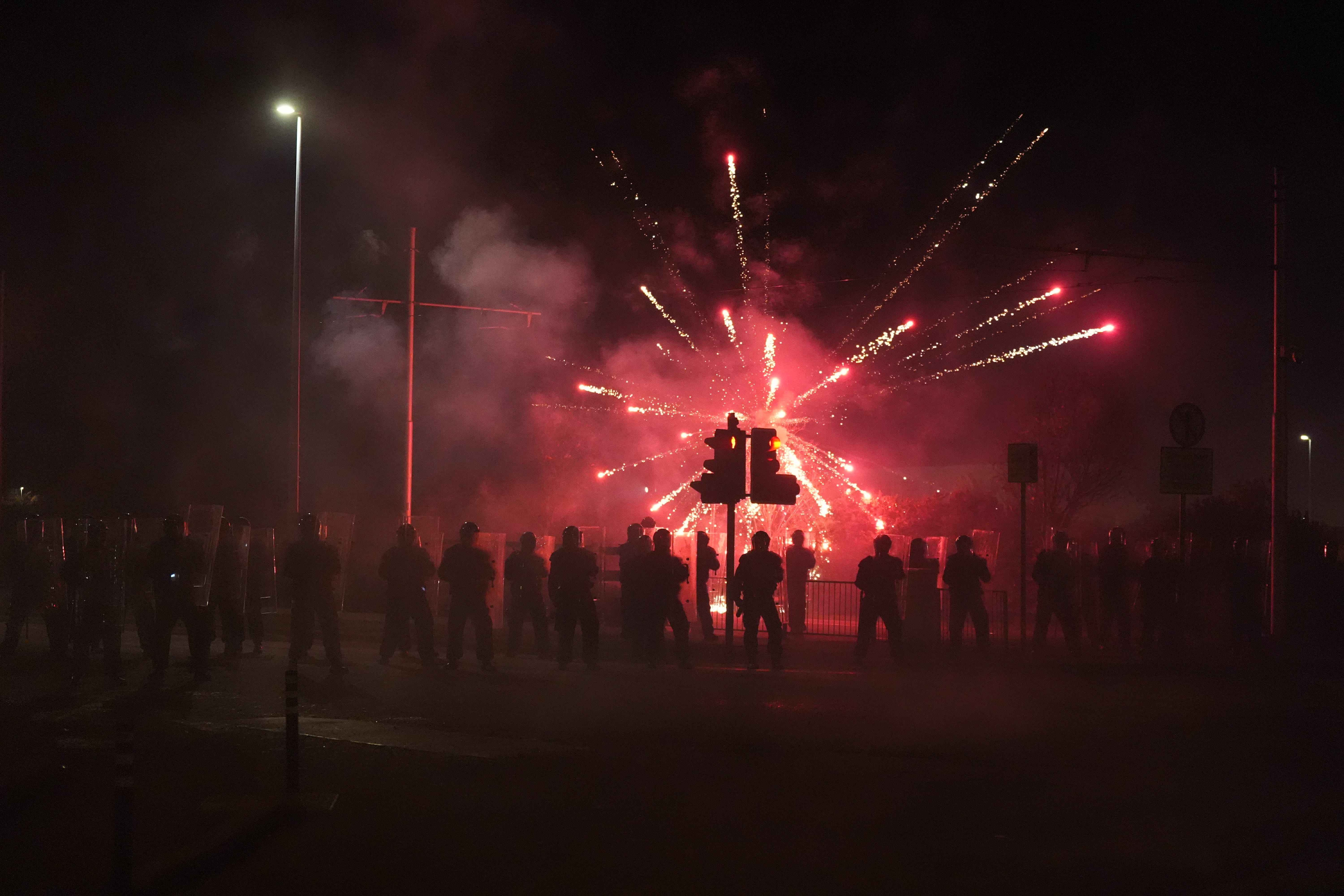 Protesters throw fireworks at Gardai (Niall Carson/PA)