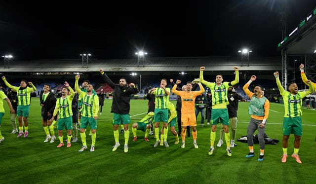 <p>AEK Larnaca players celebrating their victory in front of the away fans</p>