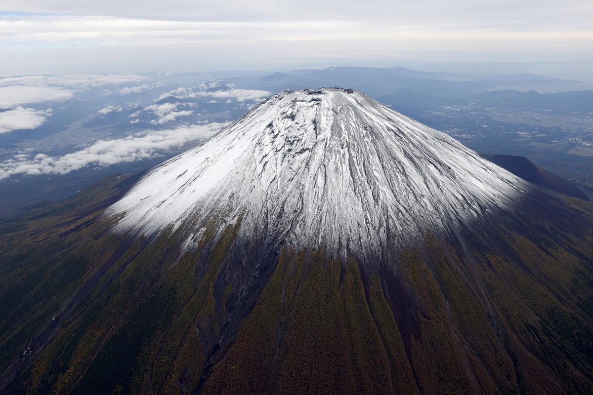 https://static.independent.co.uk/2025/10/23/9/53/A-photo-taken-from-a-helicopter-shows-the-seasons-first-snowcap-on-Mt--Fuji-Japans-highest-mountain.jpeg?trim=0,73,0,73&width=1200&height=800&crop=1200:800