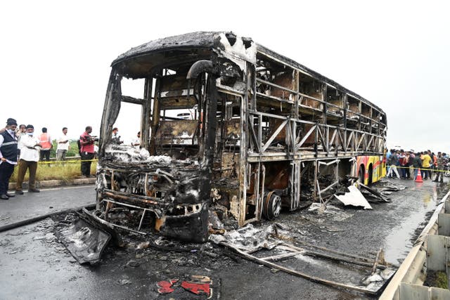 <p>Charred remains of passenger bus on highway in Chinnatekuru village, where it caught fire early Friday after a collision with a motorbike on Friday</p>