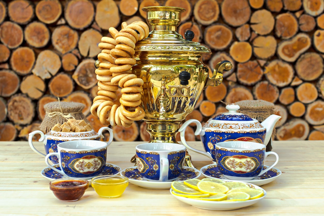 A traditional Russia samovar on the table with tea set