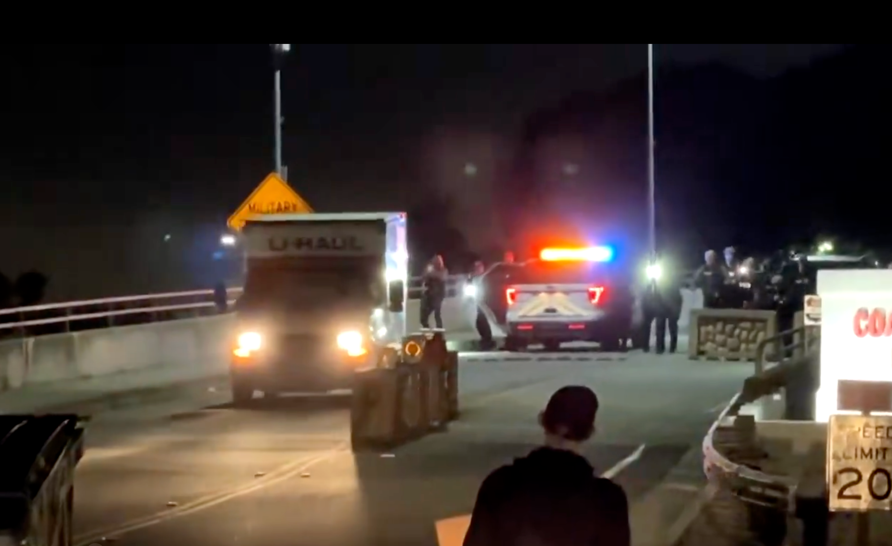 <p>The U-Haul truck seen reversing towards Coast Guard security personnel at Coast Guard Base Alameda in Oakland, California, on Thursday October 23 2025</p>