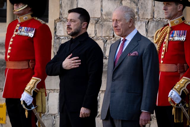 <p>Ukrainian President Volodymyr Zelensky with the King inspecting a guard of honour at Windsor Castle (Aaron Chown/PA)</p>