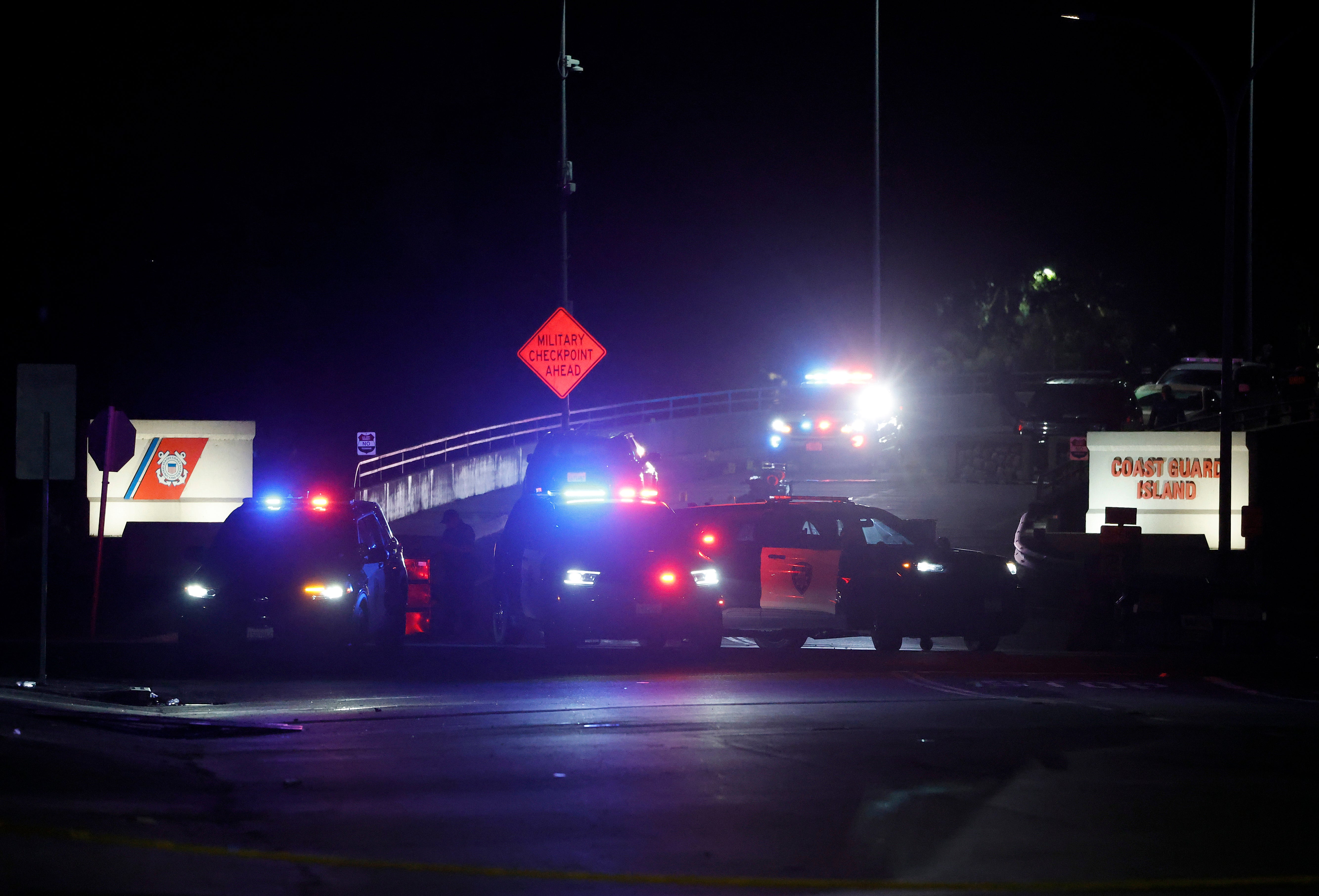 File: Police officers investigate an incident outside of Coast Guard Island Alameda on October 23, 2025 in Oakland, California