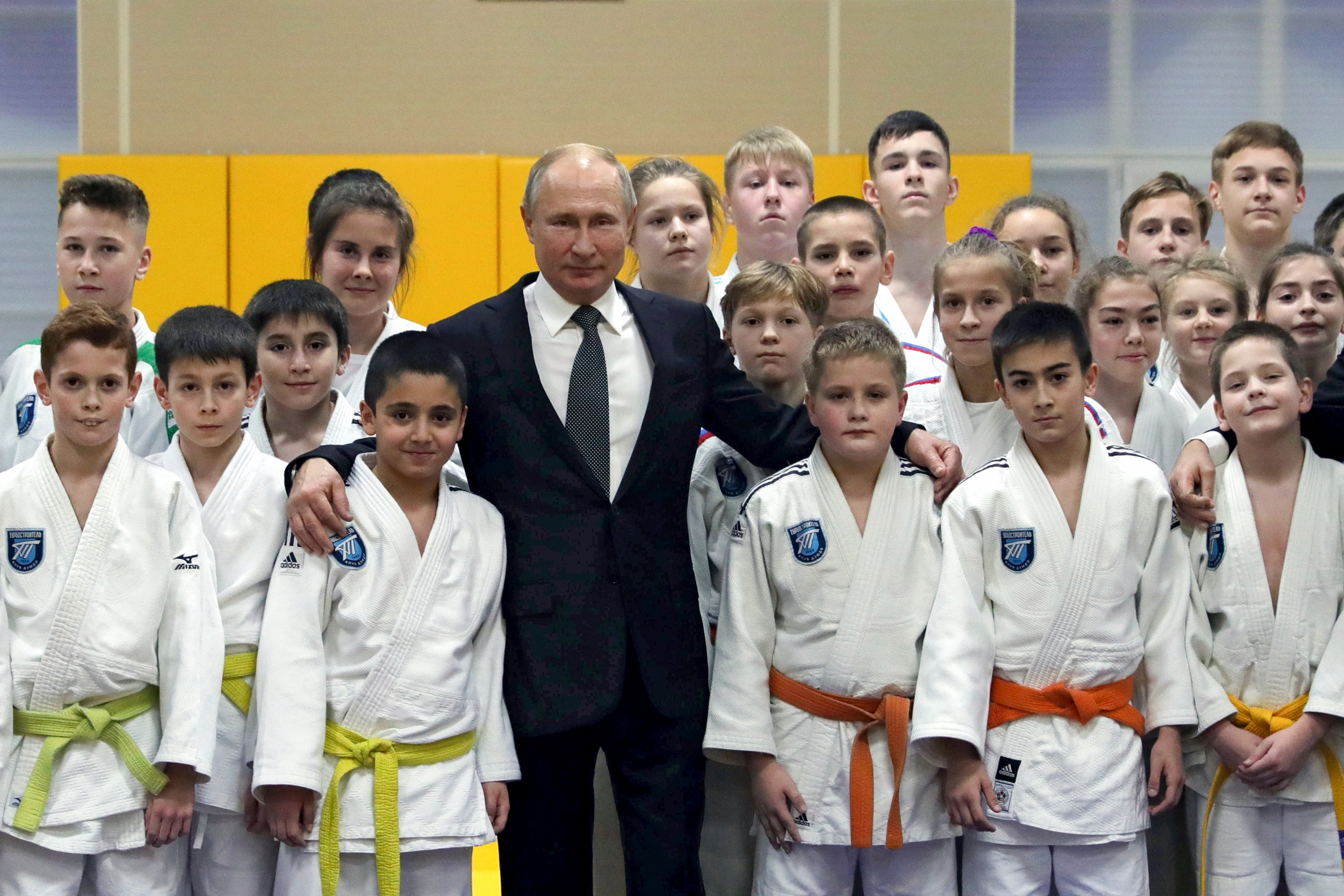 <p>Russian president Vladimir Putin poses for a photo during a visit to the judo club Turbostroitel in St Petersburg, Russia, in 2019</p>