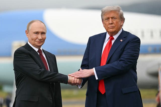 <p>US President Donald Trump greets Russian President Vladimir Putin on the tarmac after they arrived at Joint Base Elmendorf-Richardson in Anchorage, Alaska, on August 15, 2025</p>