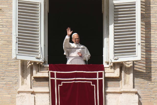 <p>Pope Leo XIV delivers his blessing as he recites the Angelus noon prayer from the window of his studio overlooking St.Peter's Square, at the Vatican</p>