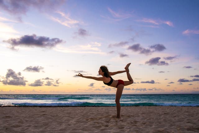<p>Relax the body with beach yoga at Silver Sands</p>