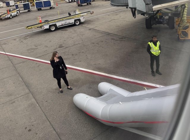<p>Frustrated passengers were delayed for hours after a Delta Airlines flight attendant accidentally activated an emergency exit slide</p>