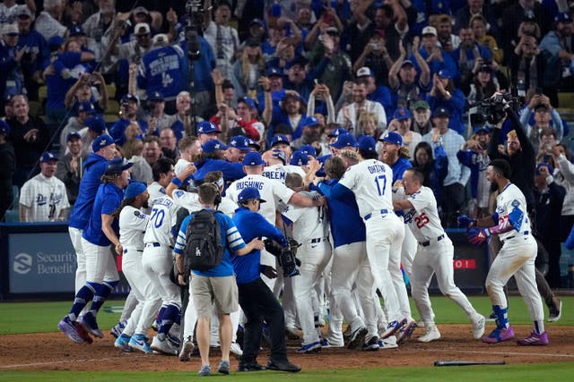 <p>Los Angeles Dodgers players celebrate Freddie Freeman's grand slam home run against the Toronto Blue Jays after Game 3 of baseball's World Series</p>
