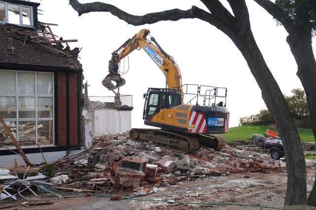 <p>Demolition begins on Jean Flick's clifftop home in Thorpeness, Suffolk</p>