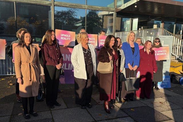 Nurses from Darlington Memorial Hospital are surrounded by supporters, as they arrive at the Civil and Family Courts and Tribunals Centre (Tom WIlkinson/PA)