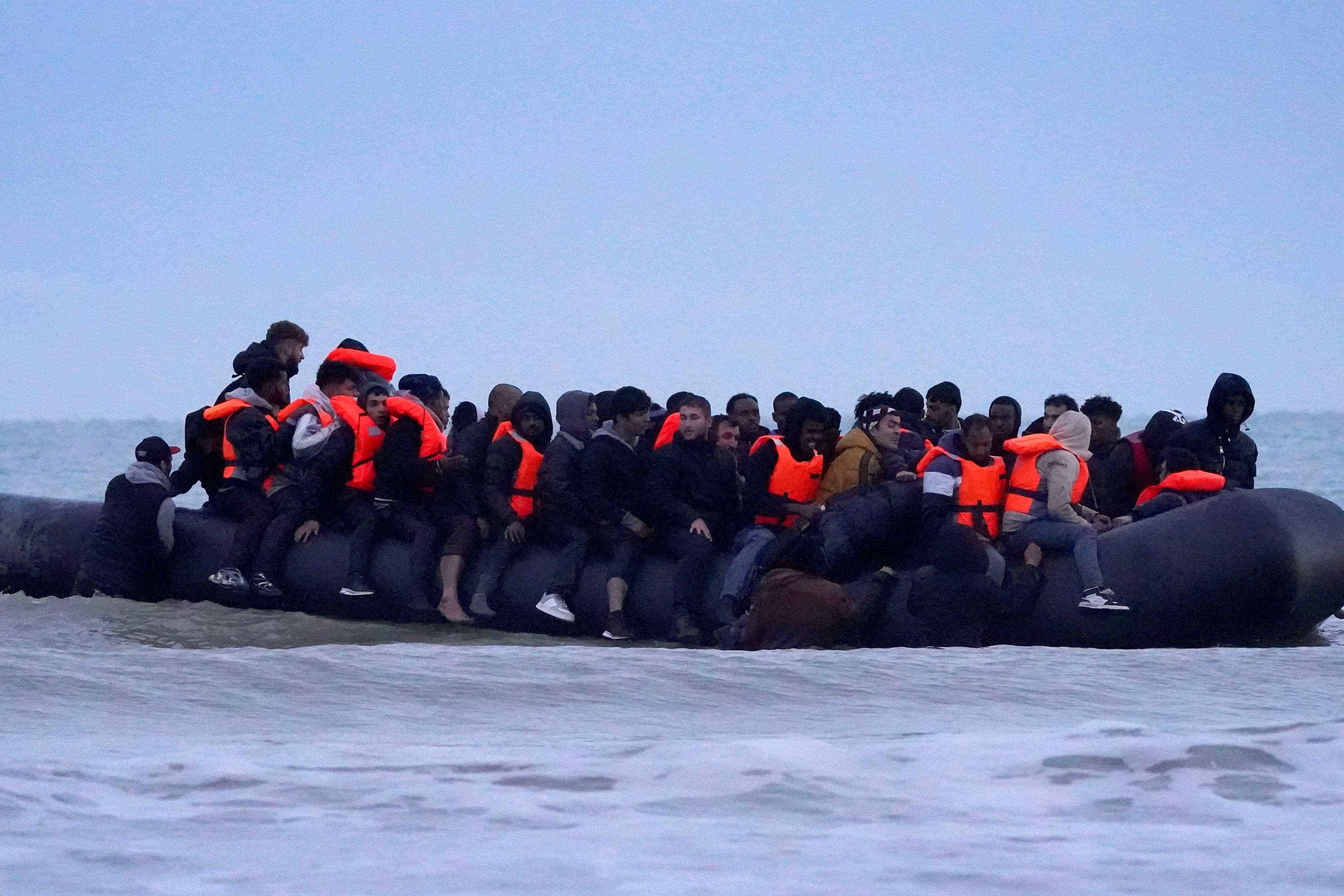 People thought to be migrants onboard a small boat in Gravelines, France (Gareth Fuller/PA)