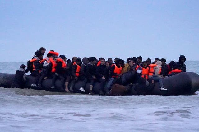 People thought to be migrants onboard a small boat in Gravelines, France (Gareth Fuller/PA)