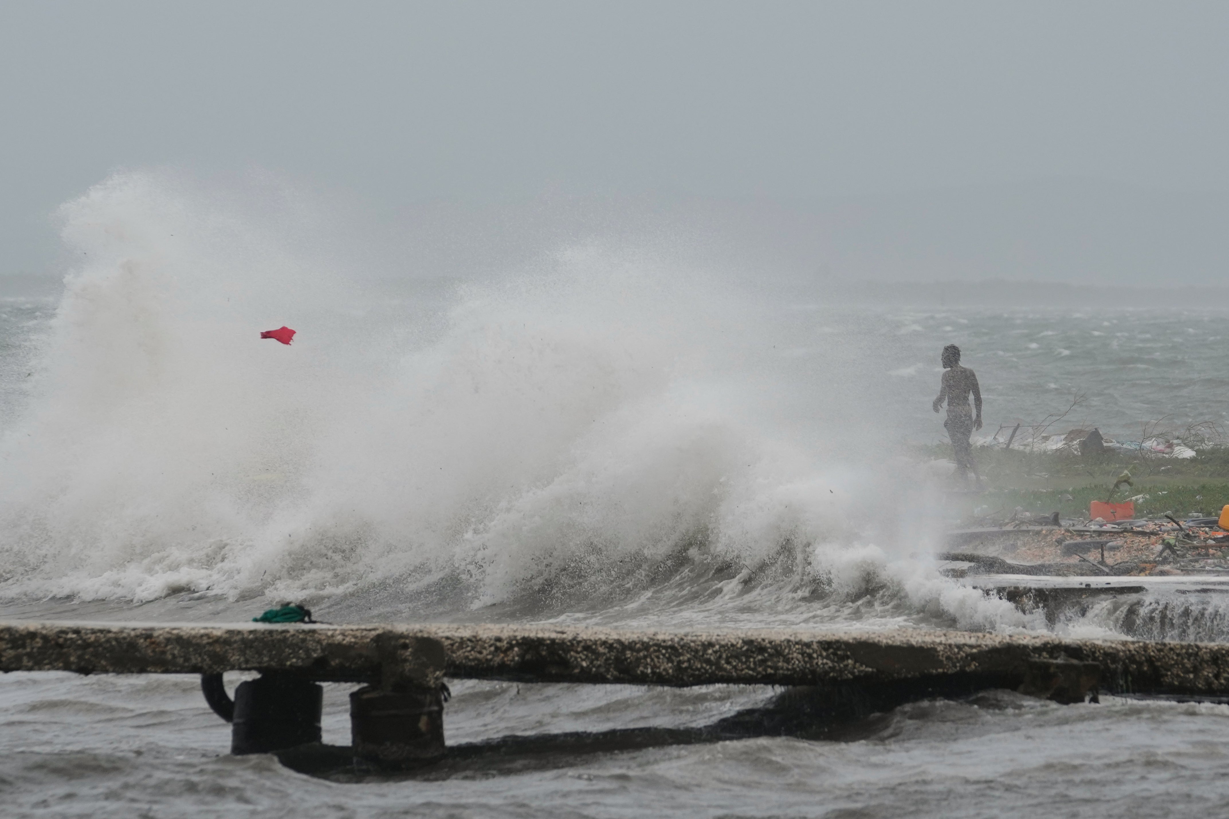 Waves crash onto a beach in Kingston, Jamaica on Tuesday