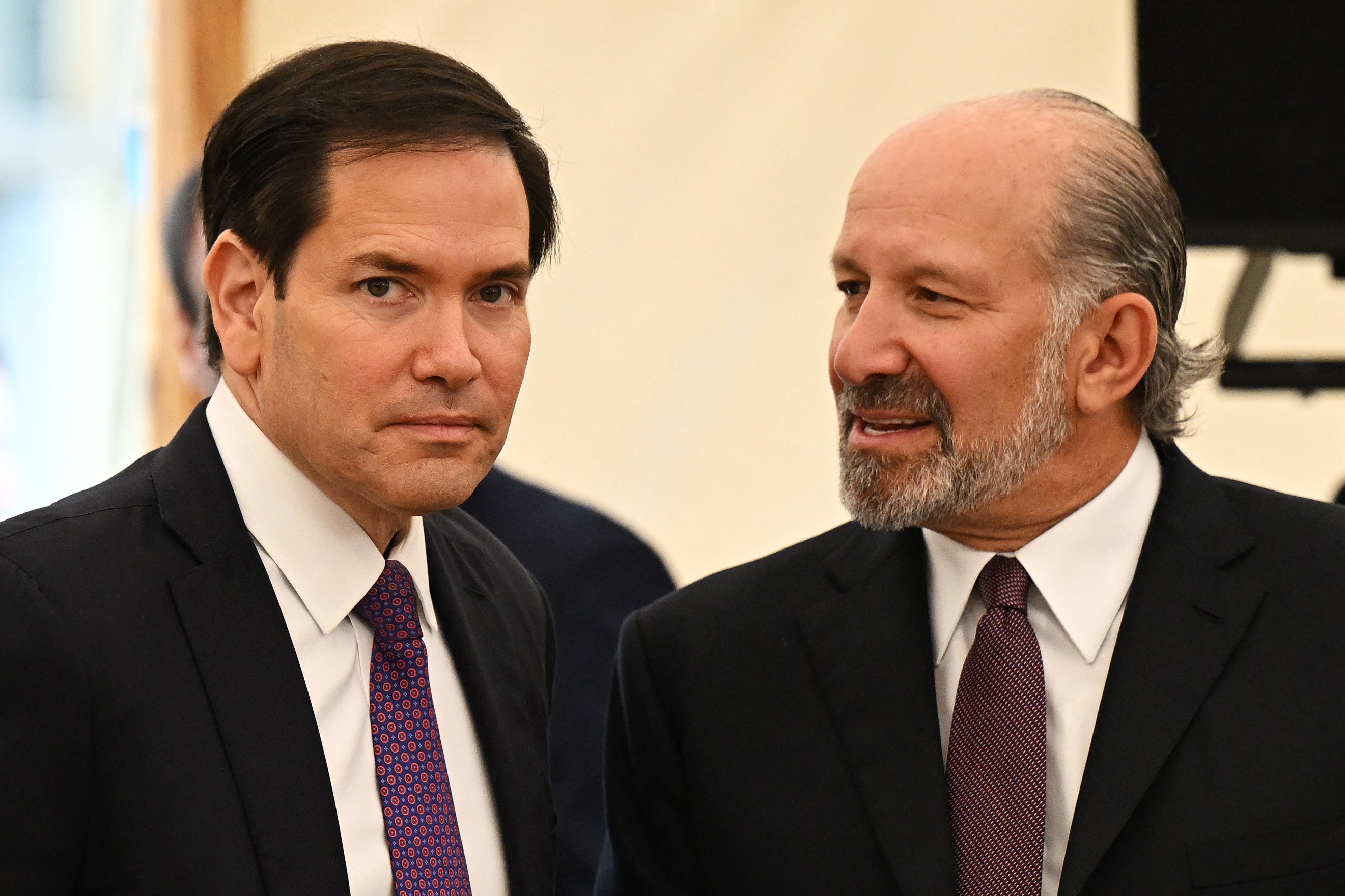 Secretary of State Marco Rubio and Commerce Secretary Howard Lutnick are under pressure from Democrats to explain the roll back