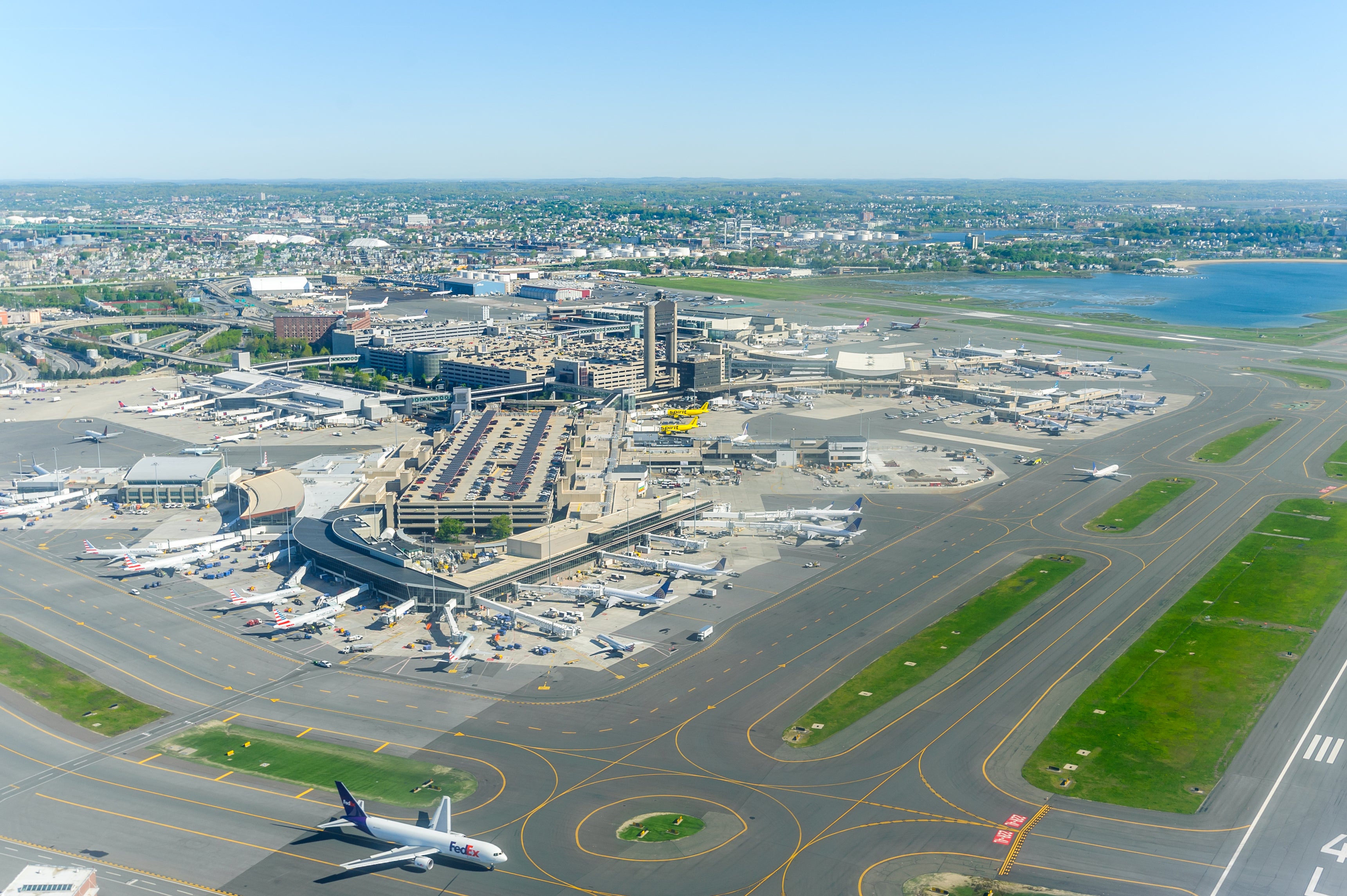 <p>Boston, MA, USA, May/18/2019: Aerial view of Boston Logan Airport's Terminal building and airplane traffic</p>