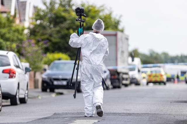 A forensic investigator in Hart Street, Southport, following the attack in July 2024 (James Speakman/PA)