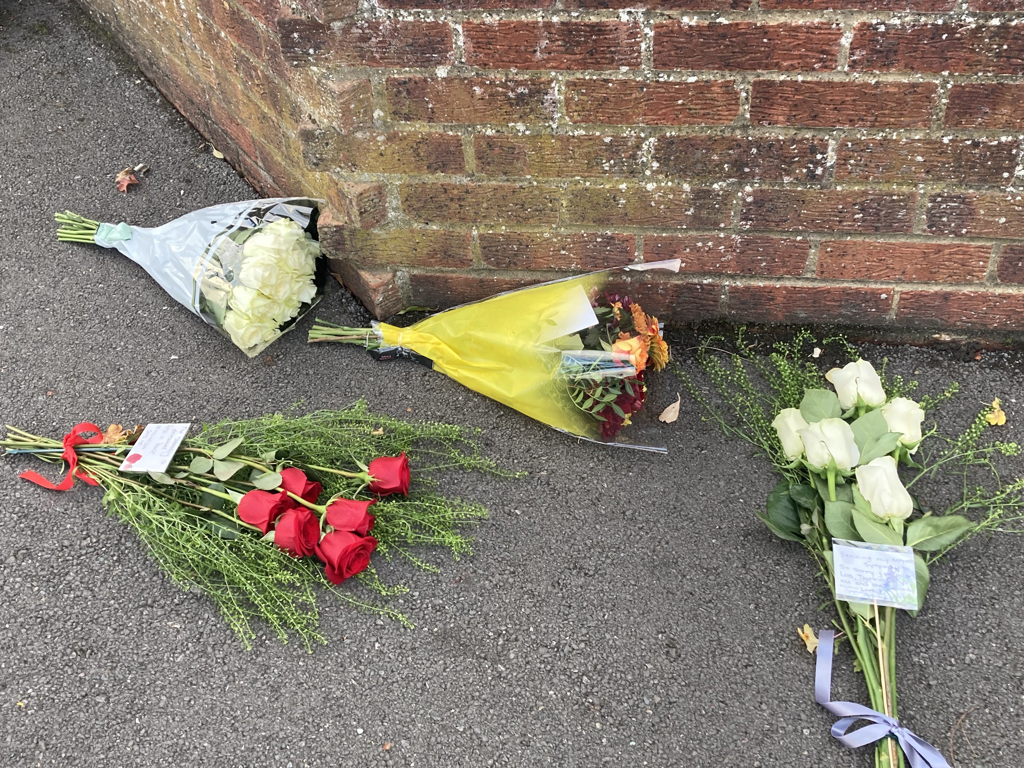 Flowers at the scene in Midhurst Gardens in Uxbridge, west London