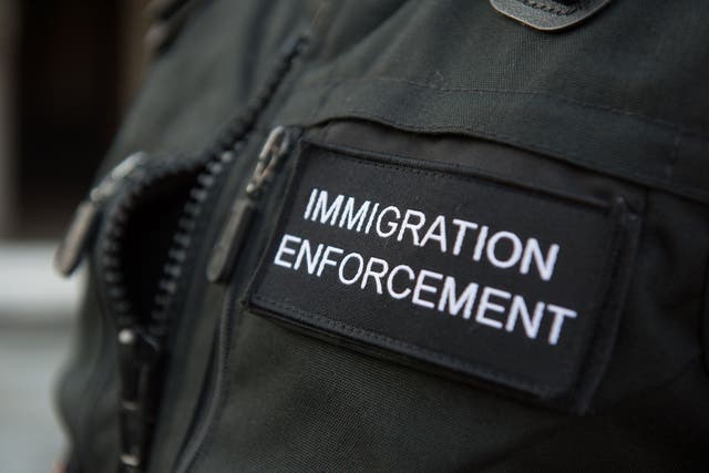 An Immigration Enforcement officer in Southall, west London (Laura Lean/PA)