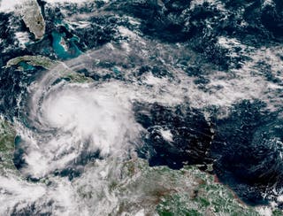 In this satellite image provided by the National Oceanic and Atmospheric Administration (NOAA), Hurricane Melissa moves northwest over the Caribbean Sea, recorded at 17:00 Z on October 27, 2025.