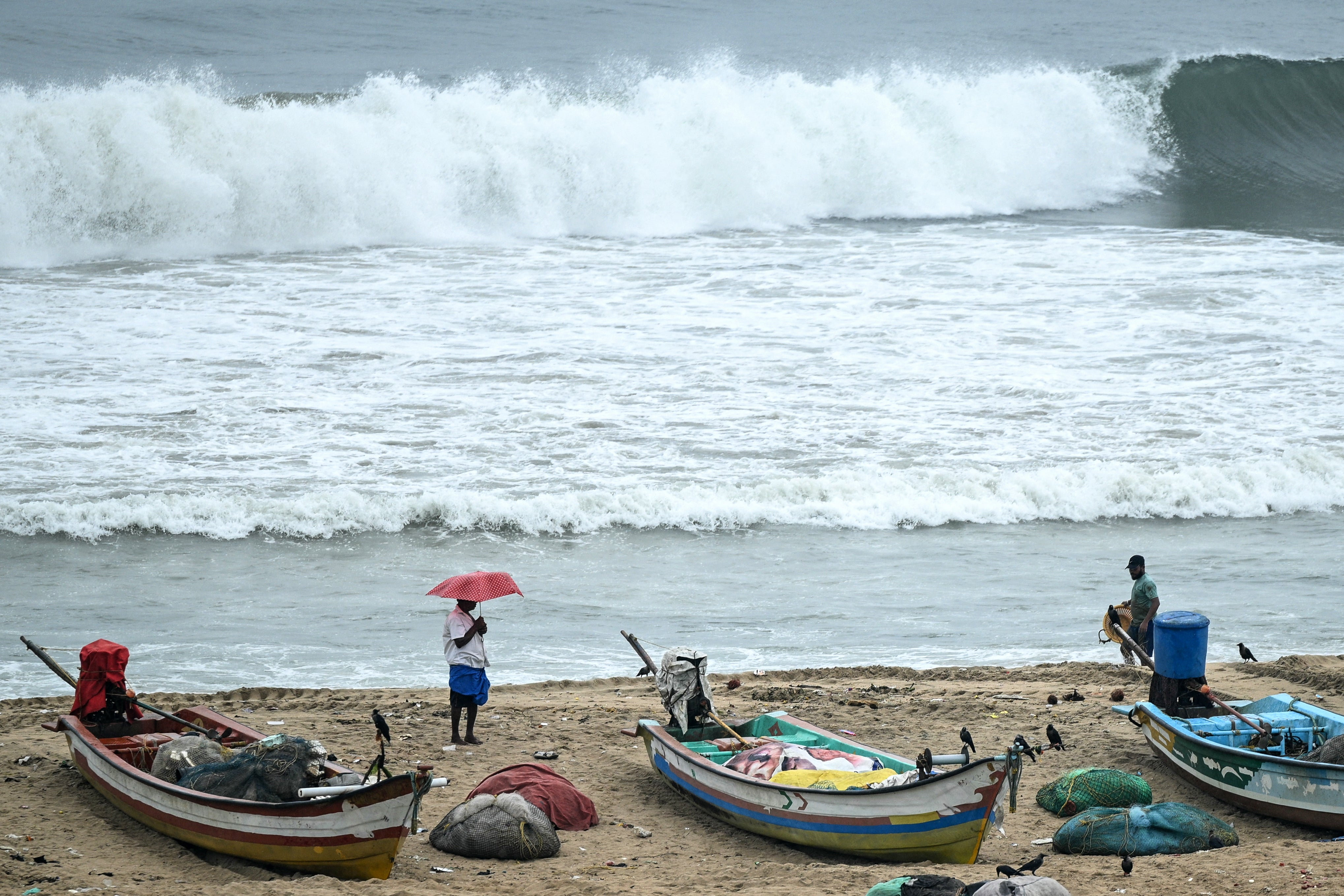 <p>Fishing boats are moored to a safer area at the Marina beach as a preventive measure ahead of Cyclone Montha in Chennai</p>