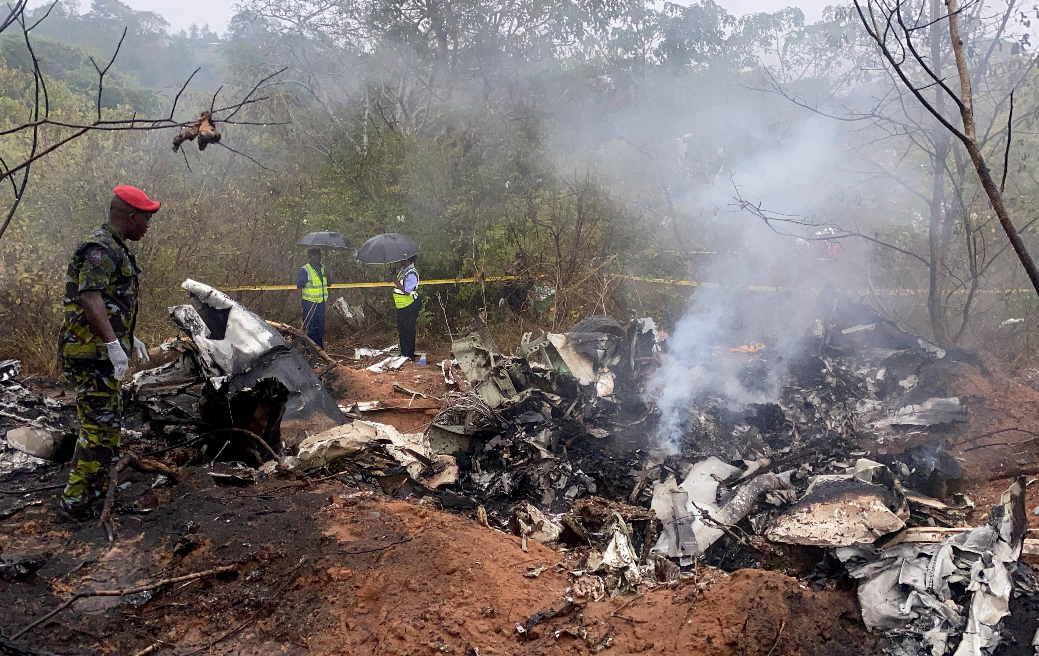 <p>Security officials secure the wreckage of the aircraft 5Y-CCA operated by Mombasa Air Services, which crashed with 12 passengers onboard on its way from Diani to Kichwa Tembo</p>