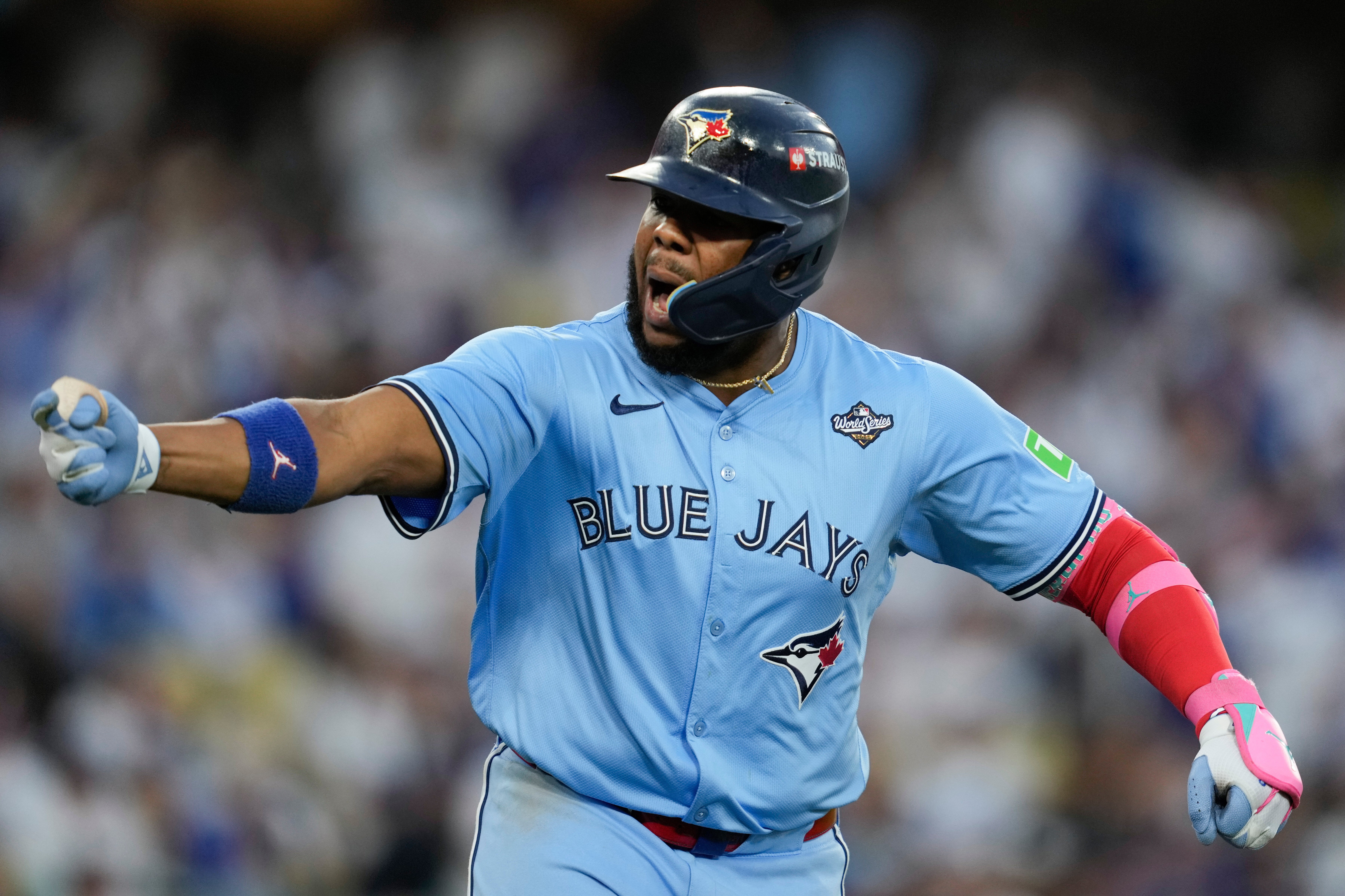 <p>Toronto Blue Jays' Vladimir Guerrero Jr. points to his dugout after hitting a two run against the Los Angeles Dodgers during the third inning in Game 4 of baseball's World Series</p>