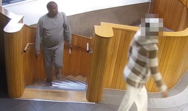 <p>Hadush Kebatu (left) in Dalston after he was mistakenly released from prison </p>