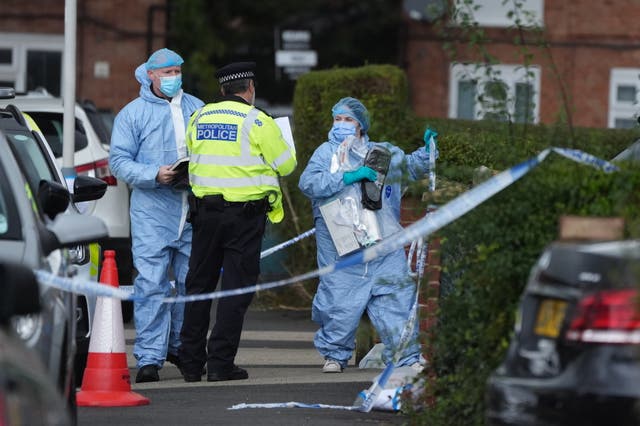 <p>Forensic officers in Midhurst Gardens in Uxbridge, west London</p>