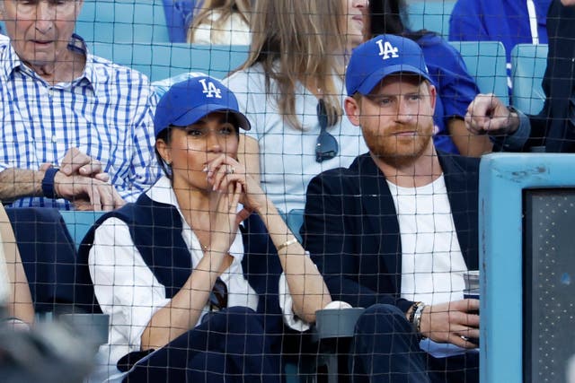 <p>Prince Harry and Meghan Markle watch Game 4 of the World Series</p>