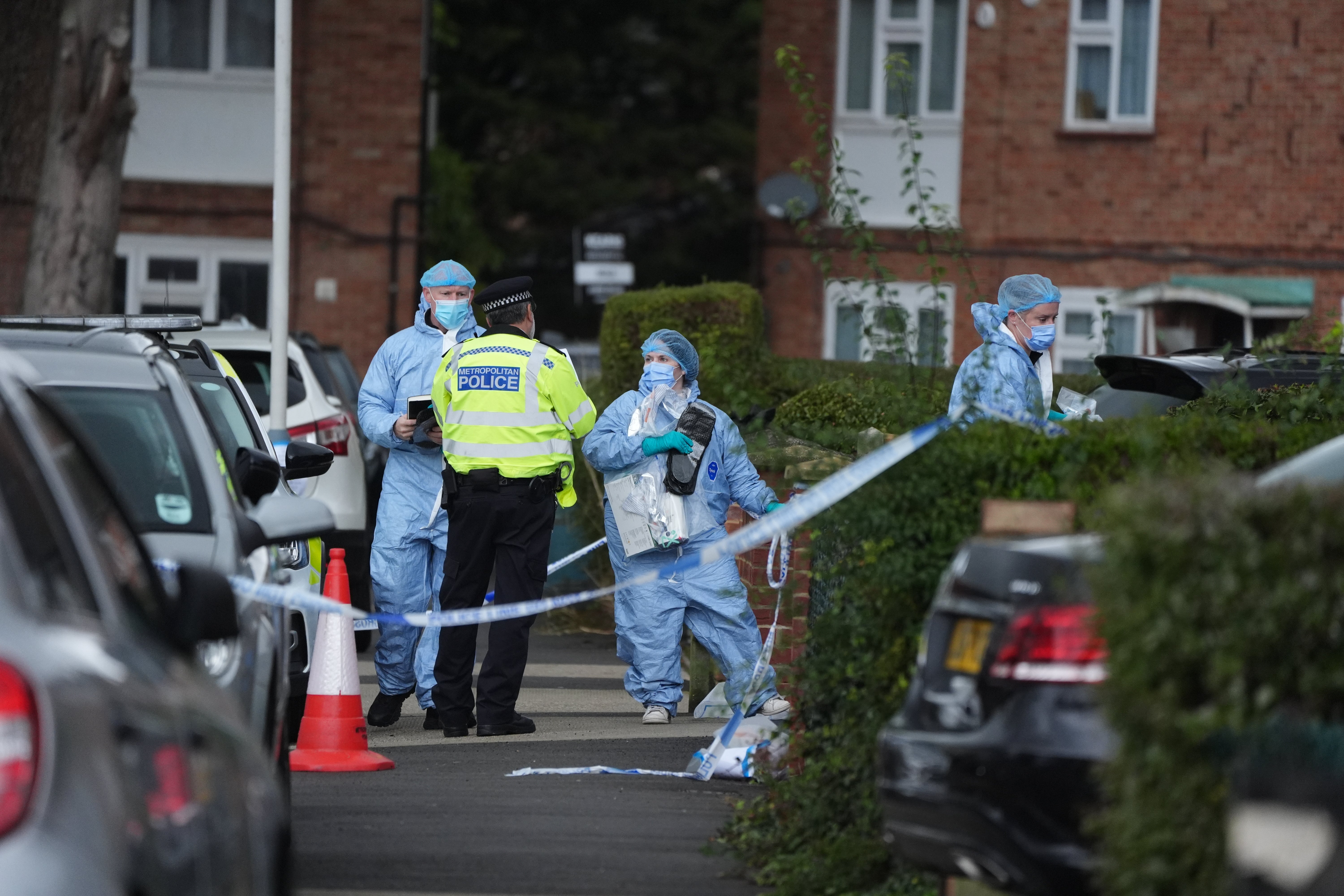 Forensic officers in Midhurst Gardens in Uxbridge, west London