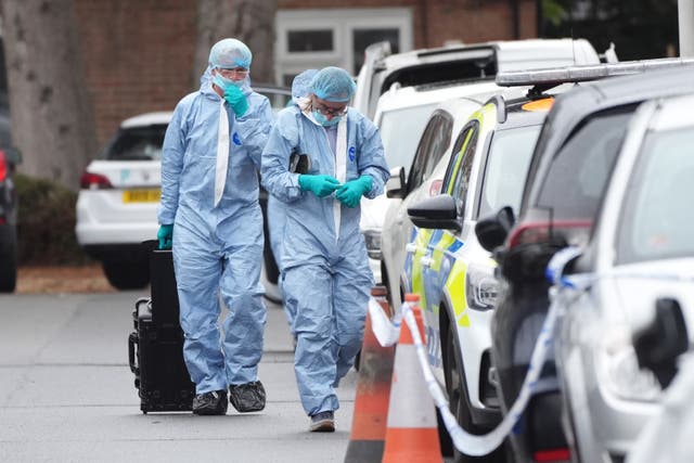 <p>Forensic officers on the scene in Midhurst Gardens, Uxbridge</p>