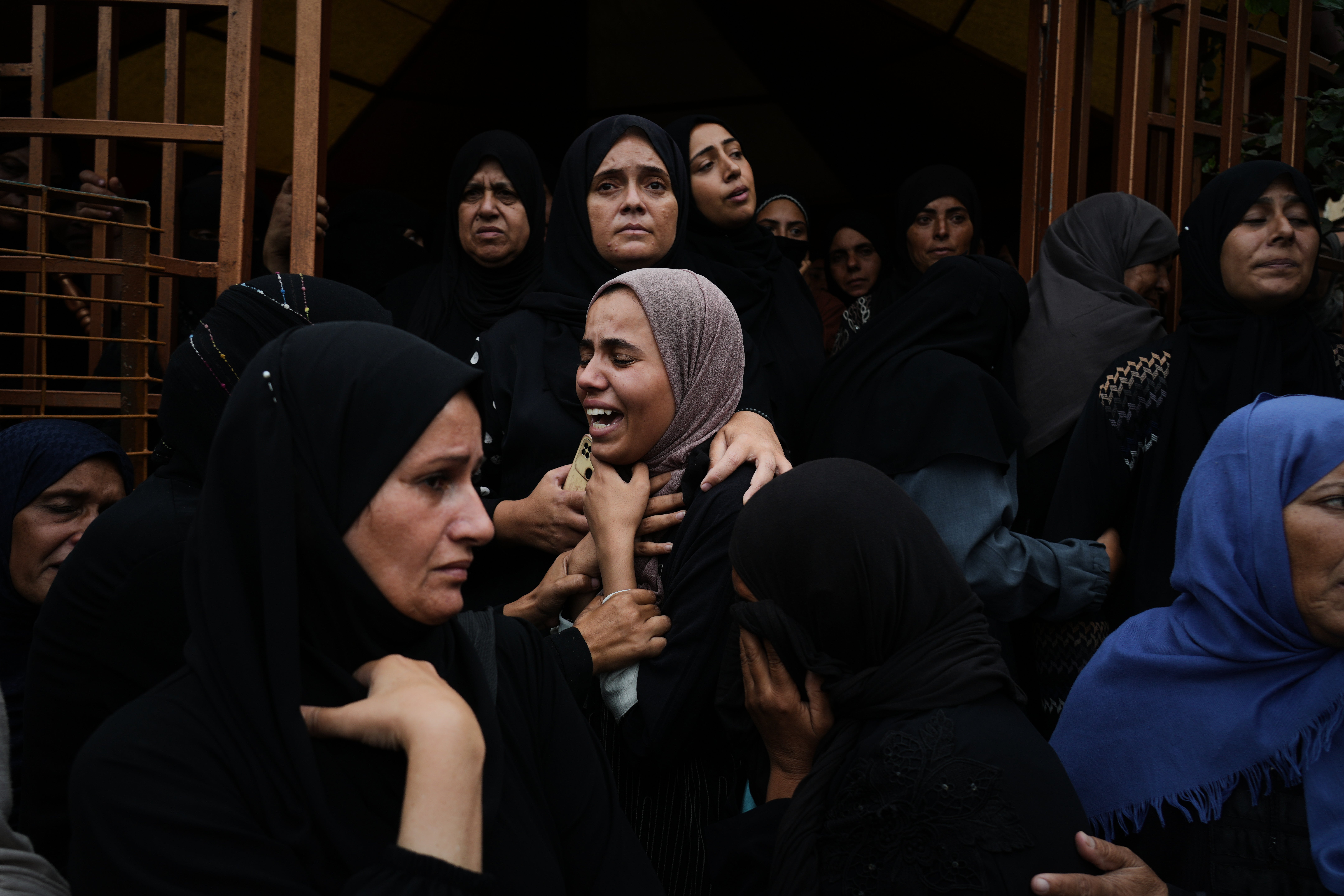<p>Mourners at the funeral of relatives killed in an Israeli army strike, at Nasser Hospital in Khan Younis on the Gaza Strip</p>