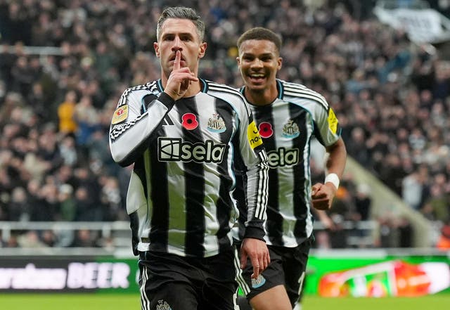 <p>Fabian Schar (left) was on target with Newcastle’s opener</p>