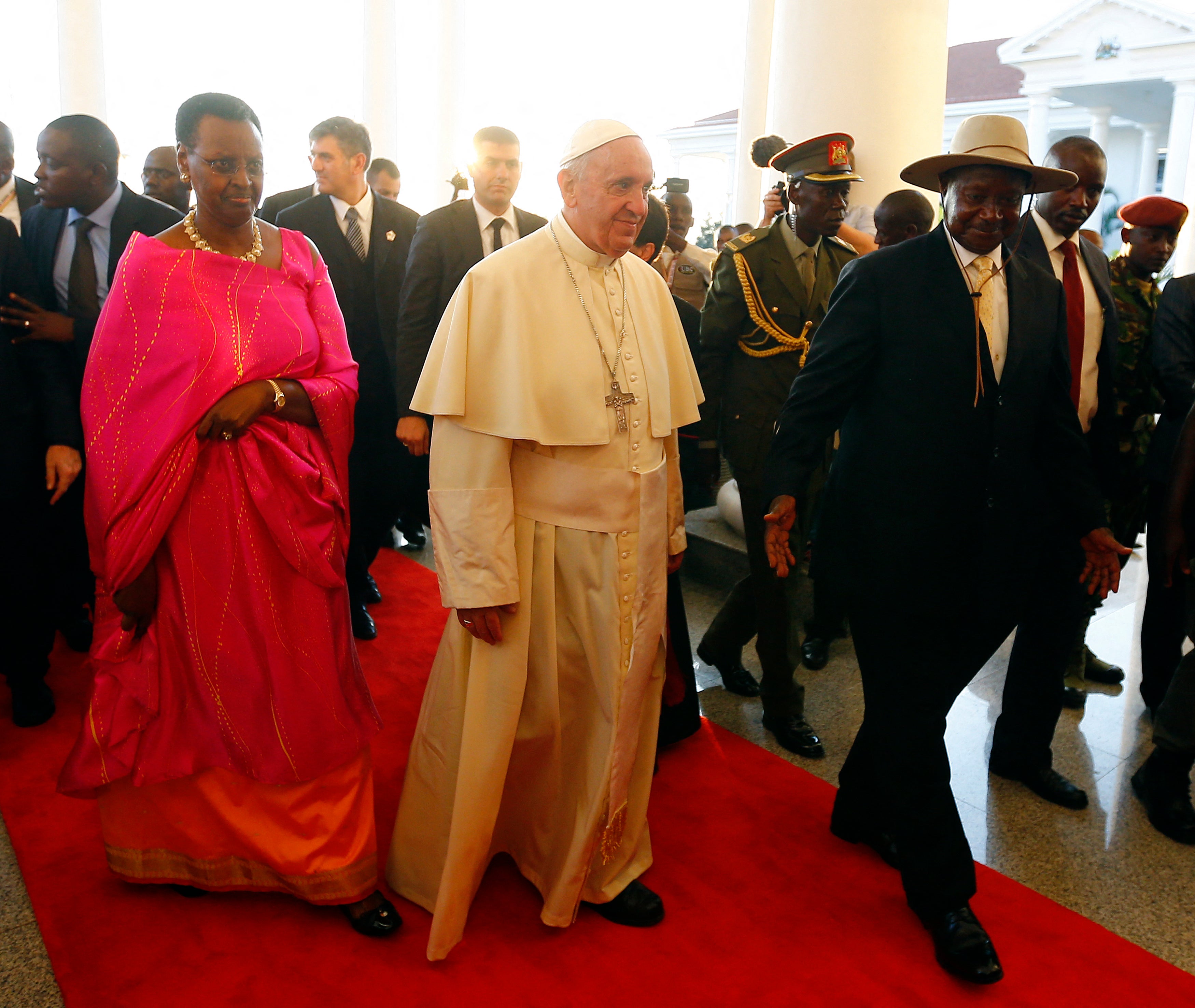 Pope Francis (C) arrives with then Uganda president Yoweri Museveni and his wife Janet at the presidential palace in Kampala Uganda during his landmark trip to Africa