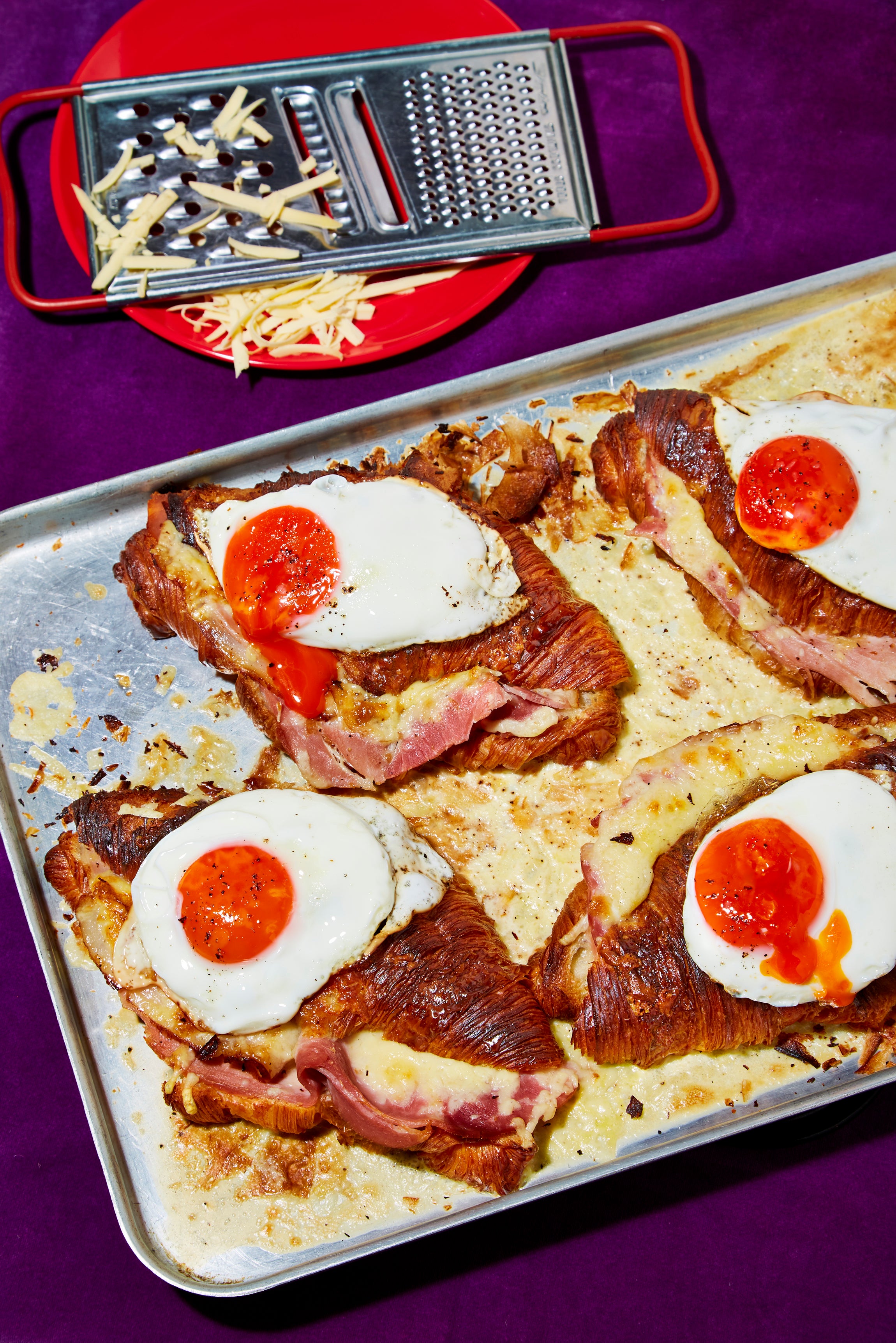 Breakfast meets brunch in this croque-madame-inspired croissant bake – indulgence by the trayful