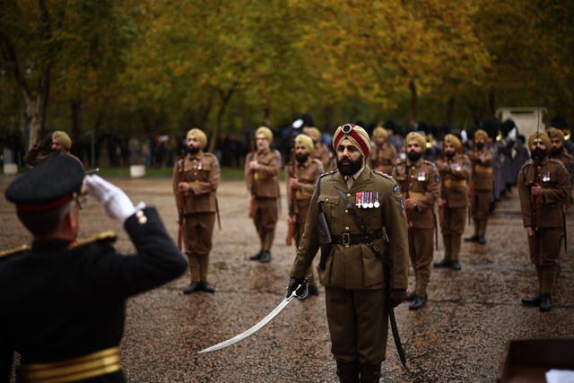 <p>British military and civilian volunteers wear original First World War Sikh infantry uniforms and equipment for the 1914 Sikhs ceremonial marching group launch at Wellington Barracks</p>