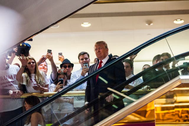 <p>Donald Trump, seen here descending Trump Tower's so-called golden escalator, is now being sued over an injury allegedly caused by the moving staircase made infamous when he used it to announce his 2016 presidential run</p>