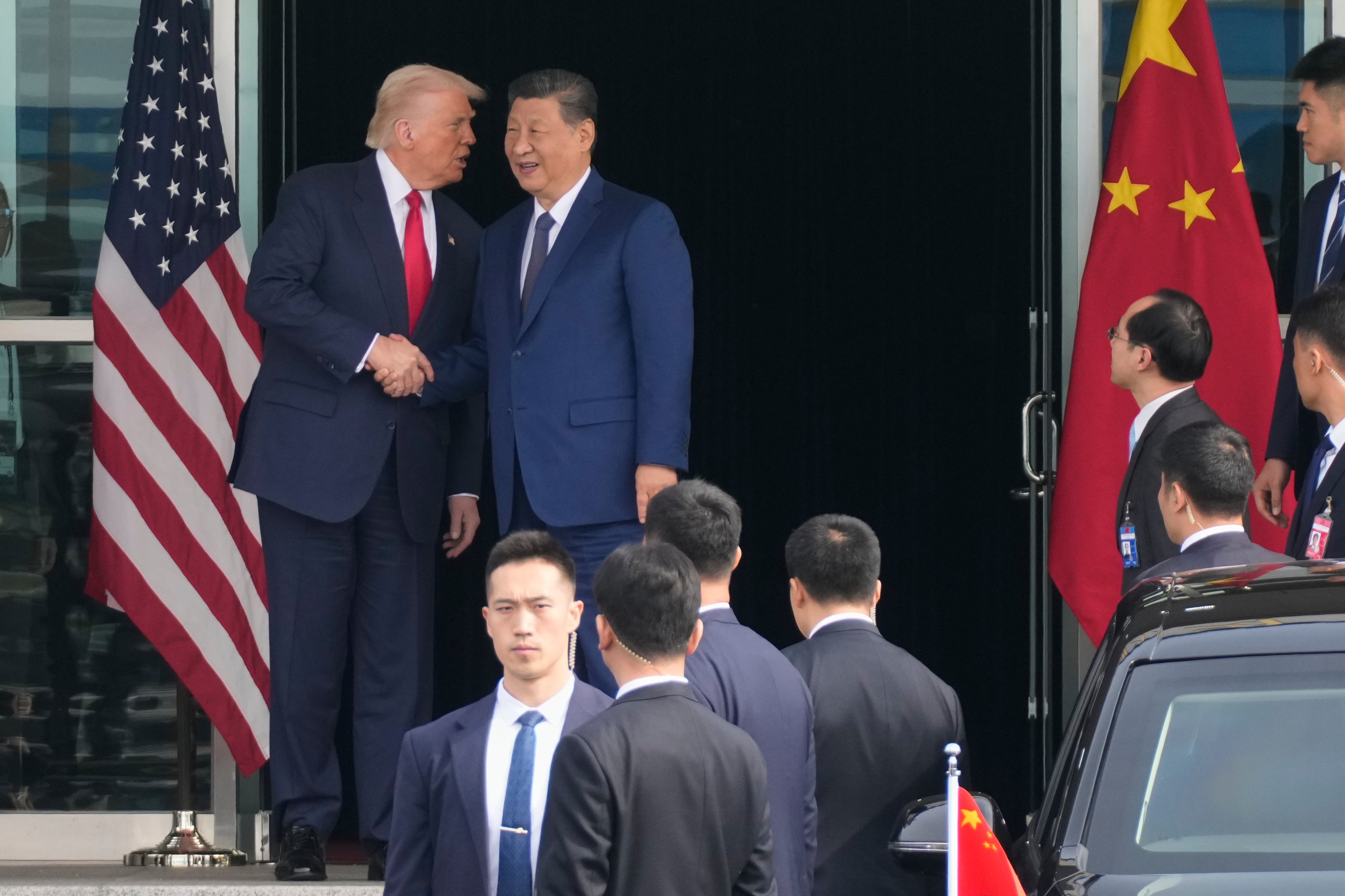 President Donald Trump left, and Chinese President Xi Jinping, shake hands before their U.S.-China summit talk at Gimhae International Airport in Busan, South Korea, Thursday, 30 Oct 2025