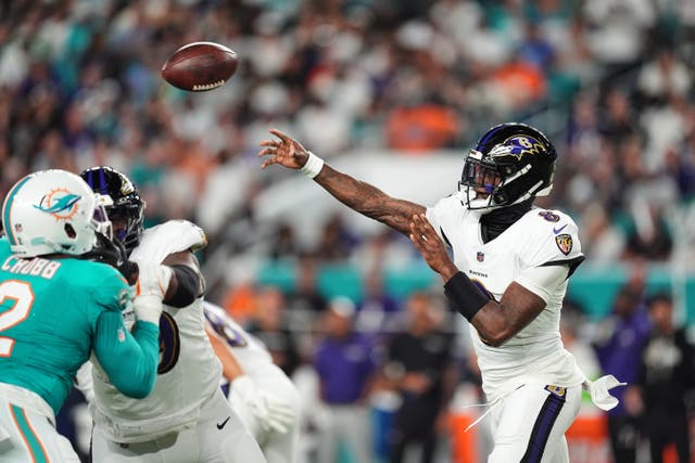Baltimore Ravens quarterback Lamar Jackson throws against the Miami Dolphins (Rebecca Blackwell/AP)