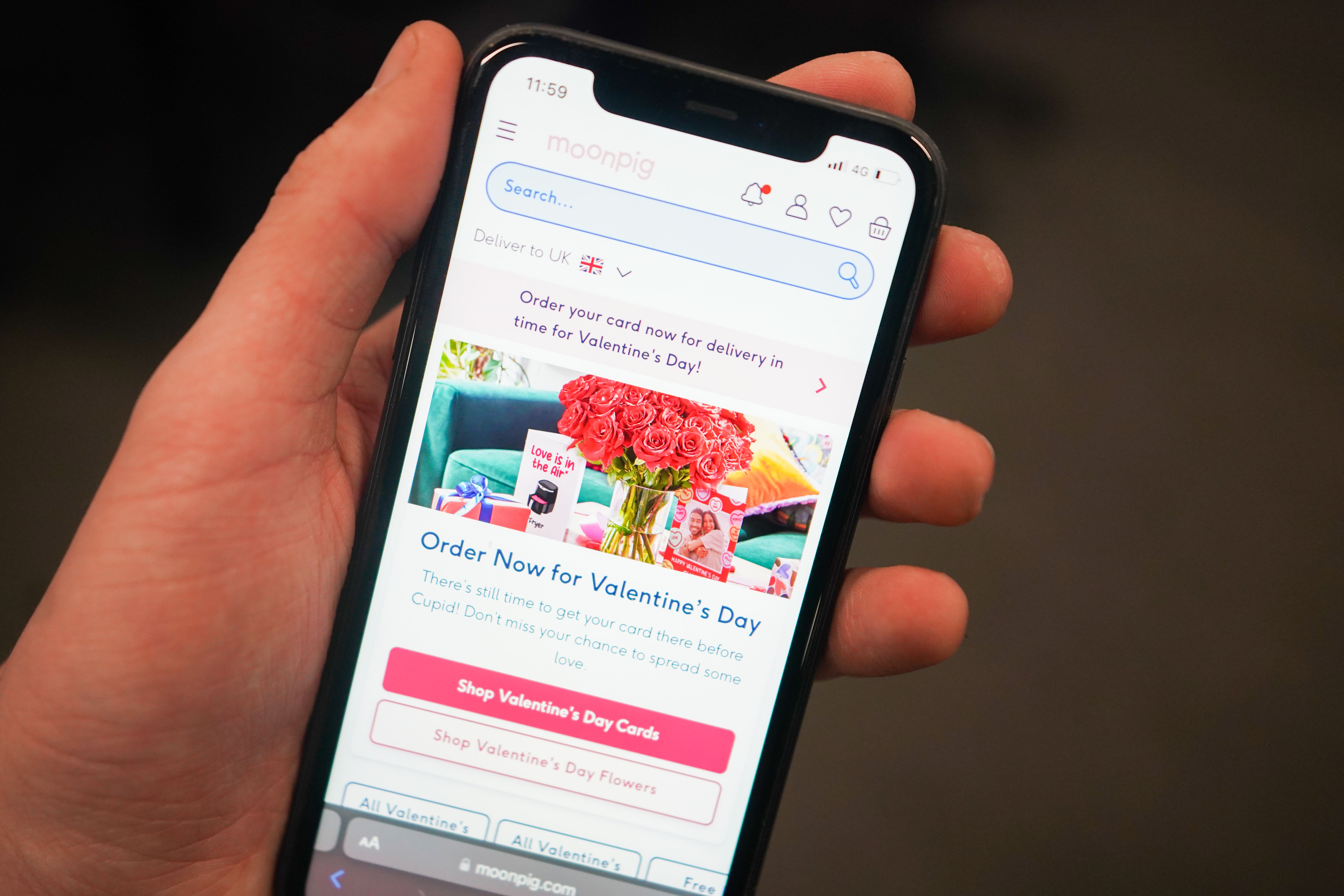 The Moonpig website on a mobile phone (James Manning/PA)
