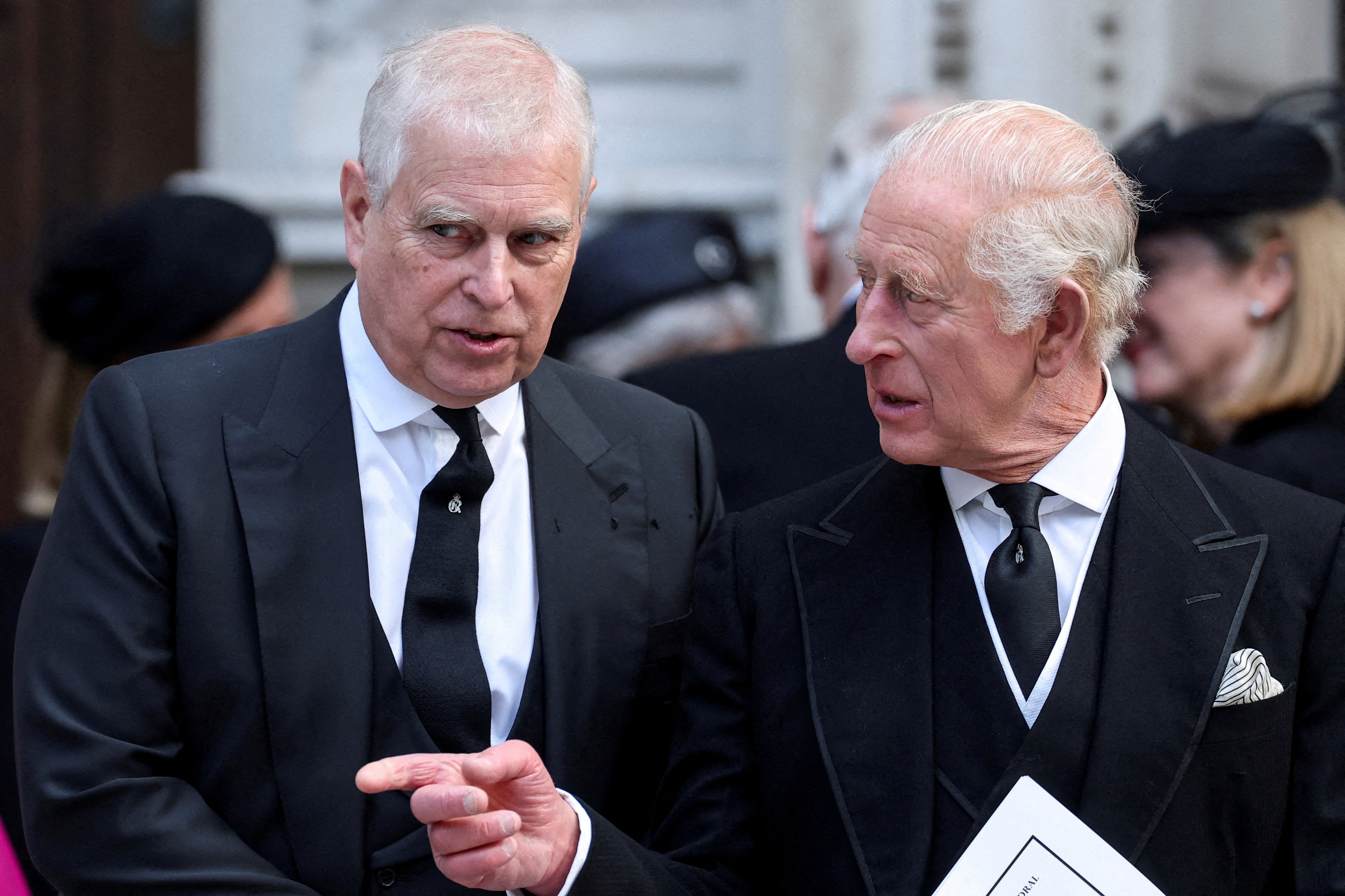 Andrew speaks with King Charles as they leave Westminster Cathedral at the end of the Requiem Mass, on the day of the funeral of Britain's Katharine, Duchess of Kent earlier this year