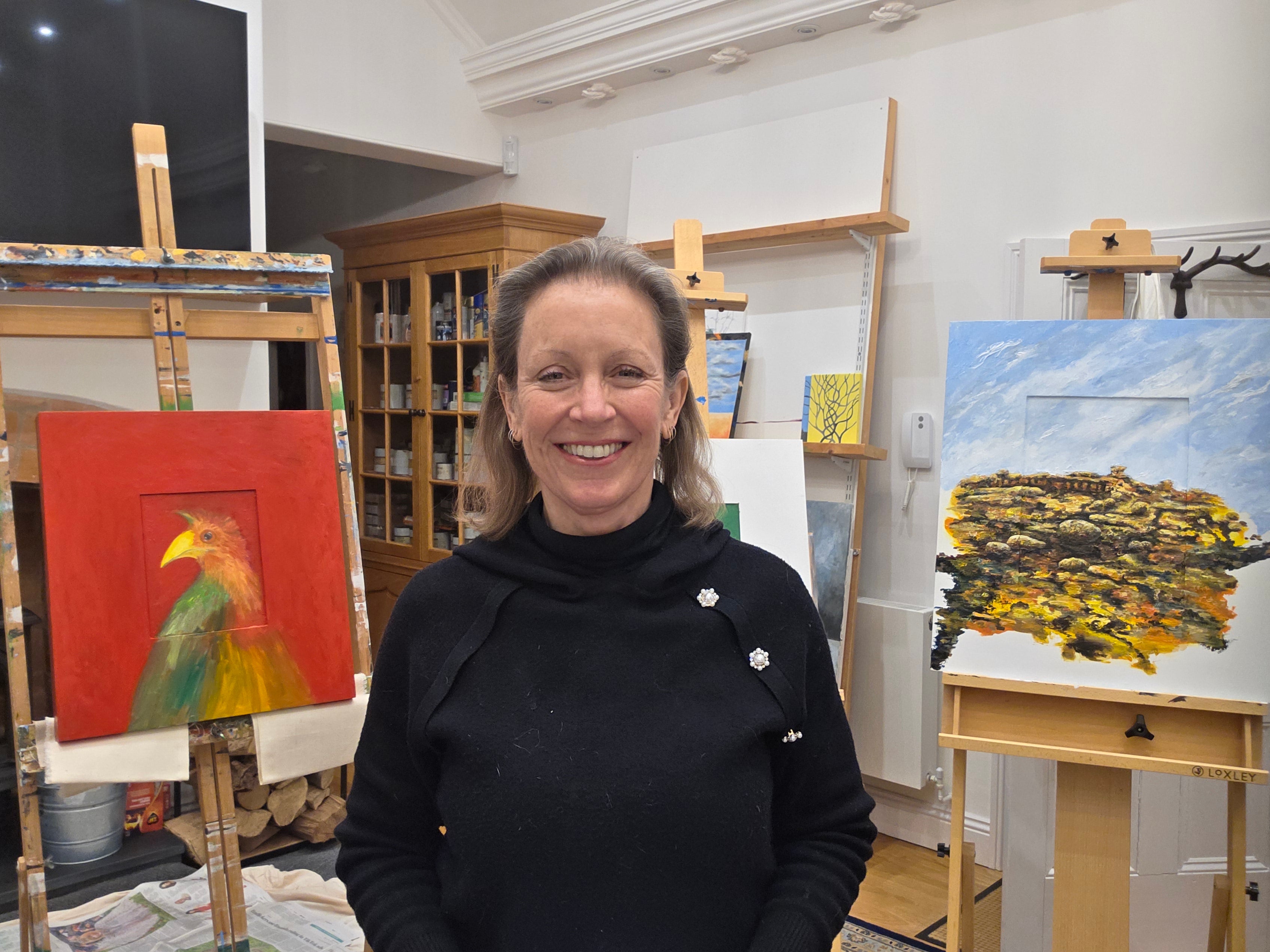 <p>Frieda Hughes and two of her paintings</p>